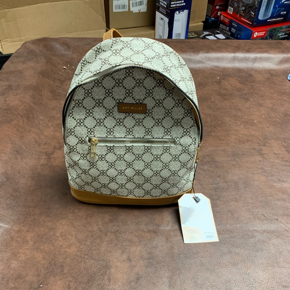 Amy Miller backpack NWT 9x11x11 inside zipper and pocket polyurethane polyester